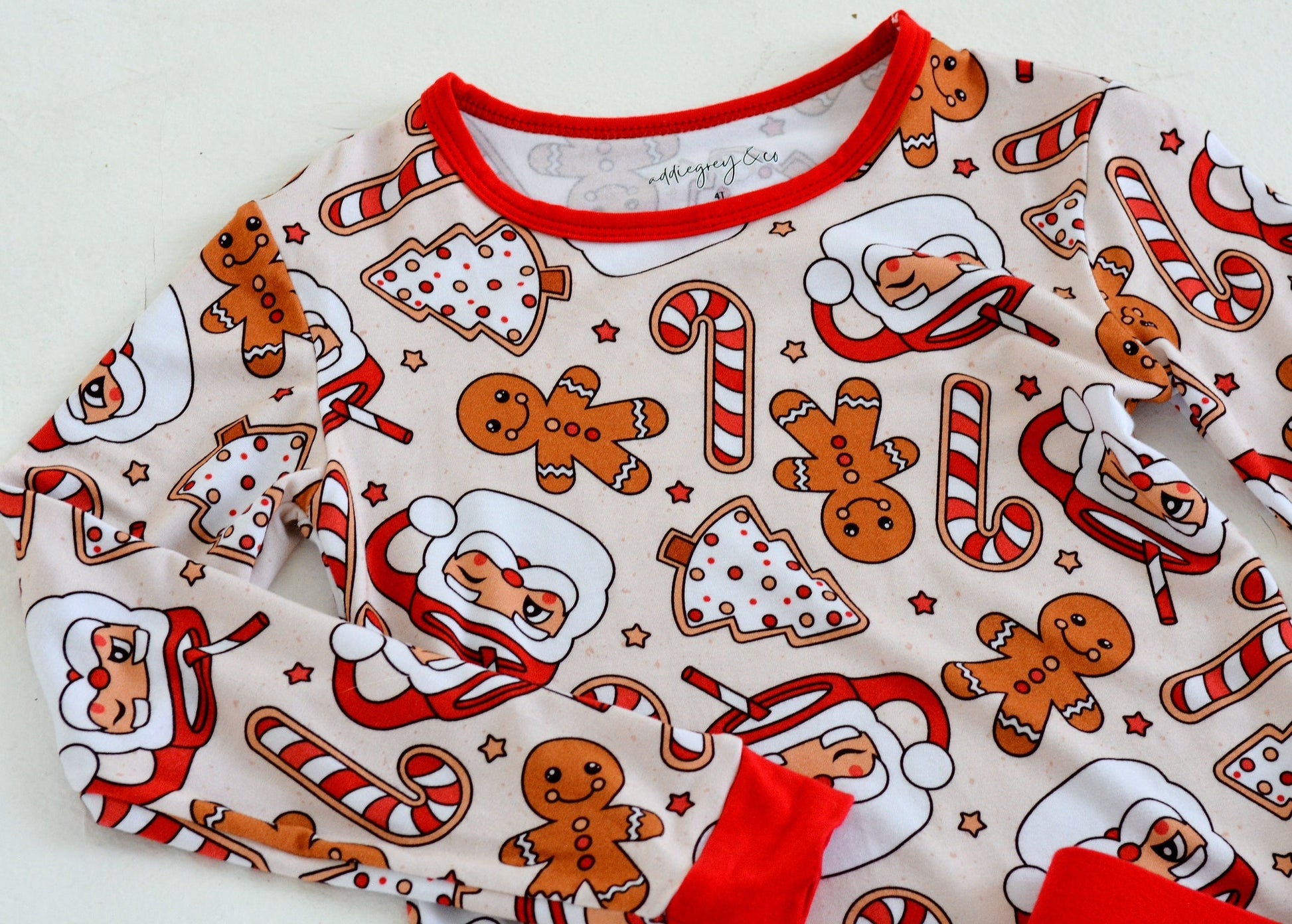 Toddler wearing Gingerbread Santa bamboo two-piece pajamas — cozy festive holiday sleepwear | AddieGrey & Co