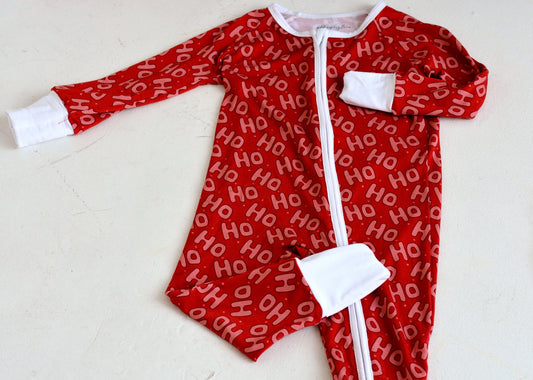 Ho Ho Ho bamboo zippy and two-piece pajama set flat lay — bold red Christmas sleepwear in newborn through 9T/10T | AddieGrey & Co