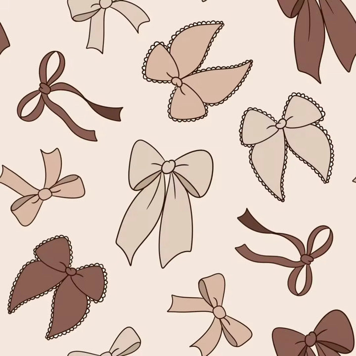 Infant in Timeless Bows bamboo zippy pajamas — classic neutral bow print on 95% bamboo fabric | AddieGrey & Co
